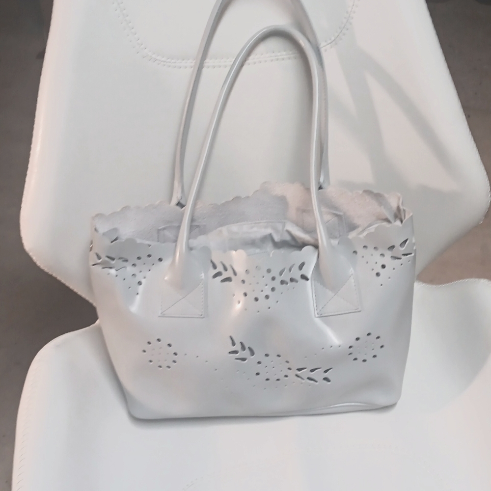 This post is for Furla Beige Leather Floral Cut Out Removable Lining Pouch Shoul